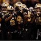 Jonathan Vilma (51) huddles with teammates. (Chris Graythen/Getty Images)